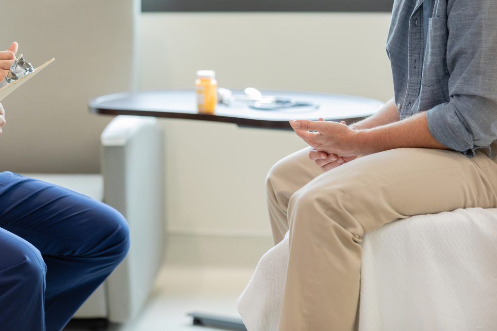 Image representing inpatient mental health treatment, with individuals receiving therapy and support in a residential setting.