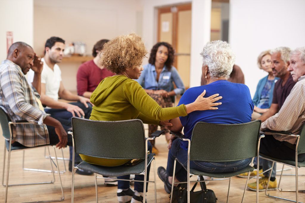 Group therapy session at a long-term rehab facility.