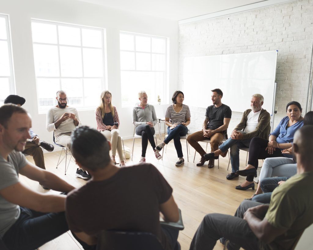 Group meeting for individuals participating in aftercare support programs.