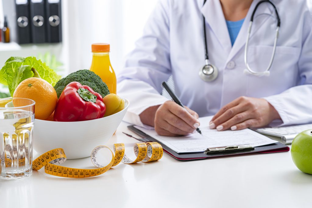Illustration of detoxification programs, showing medical professionals assisting individuals through the detox process in a controlled, safe environment