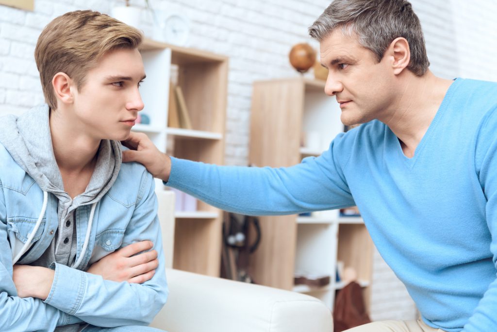 A supportive conversation where one person encourages another to seek professional help