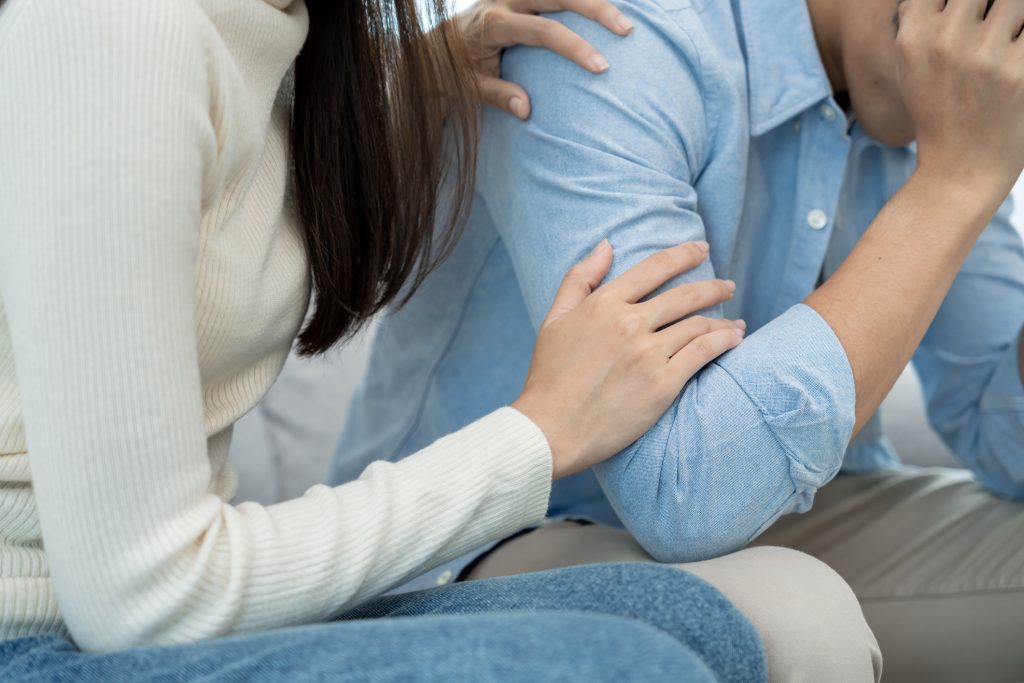 A person offering help to a loved one while maintaining healthy boundaries