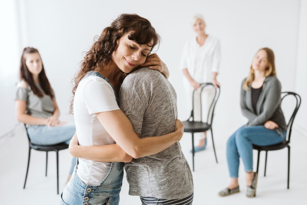 A group of family and friends coming together to plan an intervention for a loved one