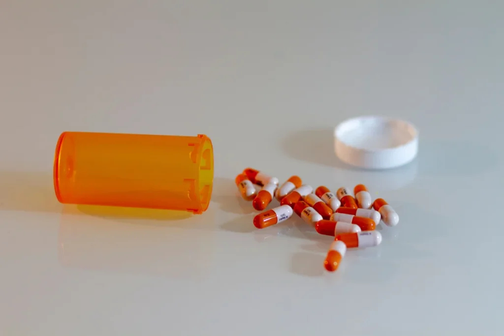 Image showing lorazepam medication bottle with warning label on addiction risks.